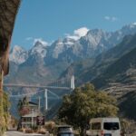scenic alpine road with mountain bridge view